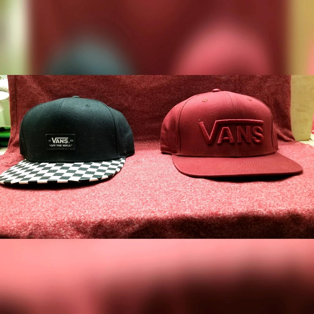 lot: two Van's hats. One deep red, the other black with checkered bill. OS